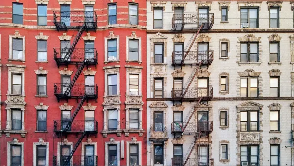 Facade of brick multistory apartment buildings in New York City with fire scapes.