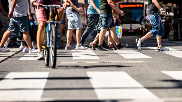 Low close-up of busy city crosswalk in Vienna, Austria.