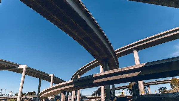 View from under tall Los Angeles freeway overpass.