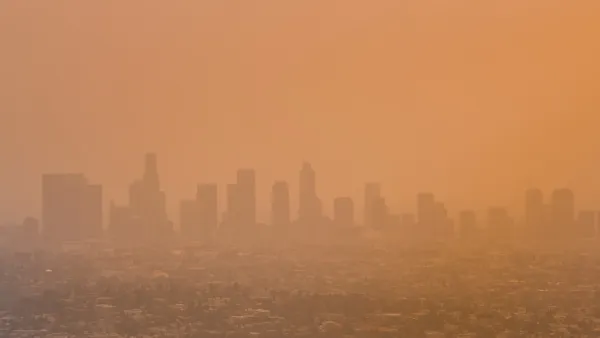 View of downtown Los Angeles, California through orange haze.