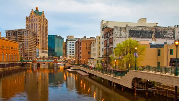 View of river and commercial buildings in downtown Milwaukee, Wisconsin.