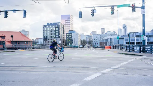 Person on bike in empty intersection in Portland, Oregon.