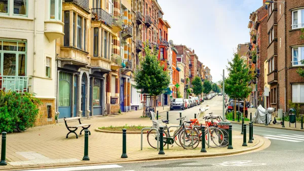 Streetscape in old neighborhood of Brussels, Belgium with bikes parked in bulb-out.