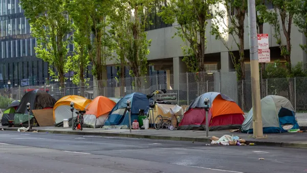 Tents set up by unhoused people on sidewalk in San Francisco, California.