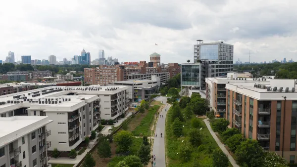 Aerial view of Atlanta BeltLine greenway with multistory buildings one ither side