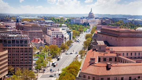 View down Pennsylvania Avenue from above with Capitol dome in background.