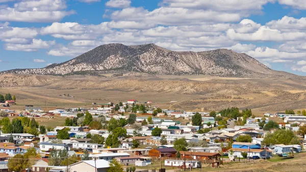 View of small town of Craig, Colorado with flat-topped mountain in background.