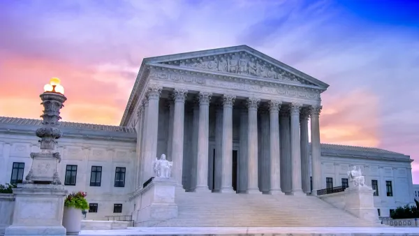 U.S. Supreme Court building in Washington, D.C. against purplish sunset light.