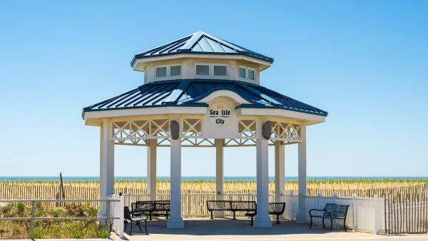 White gazebo with blue roof next to beach in Sea Isle City, New Jersey.