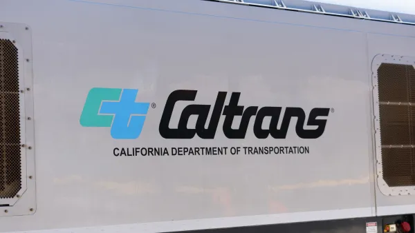 Close-up of Caltrans logo on white passenger train