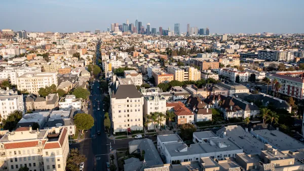 Aerial view of residential buildings in Koreatown, Los Angeles with downtown skyline in background