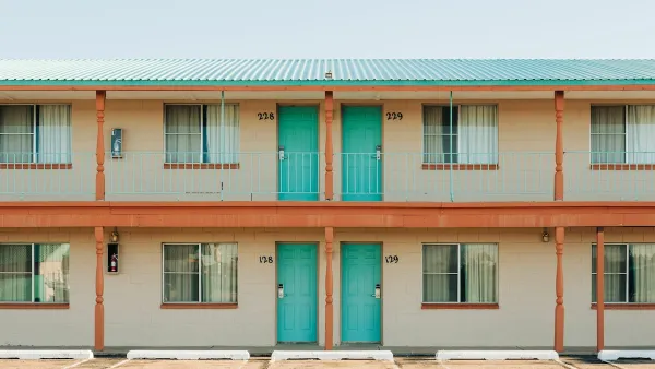 Roadside motel with turquoise room doors in Tucumcari, New Mexico.