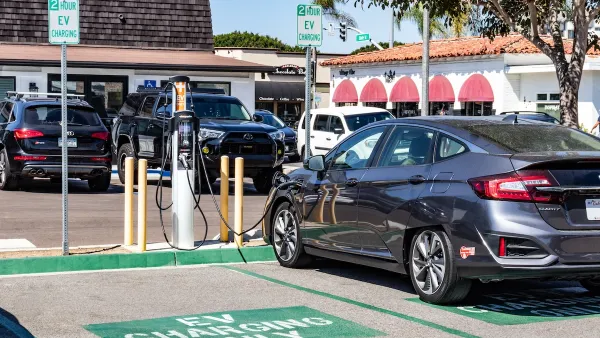 Car parked at EV charging station in parking lot in Carlsbad, California.