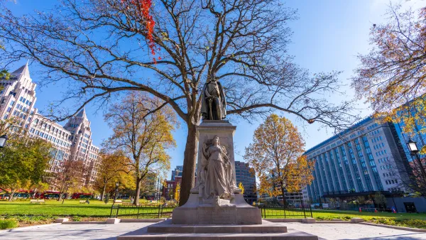 Statue in Franklin Square Park in Washington, D.C. with dry fall tree in background