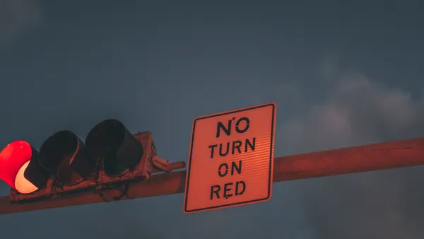 'No turn on red' sign attached to an overhead traffic light