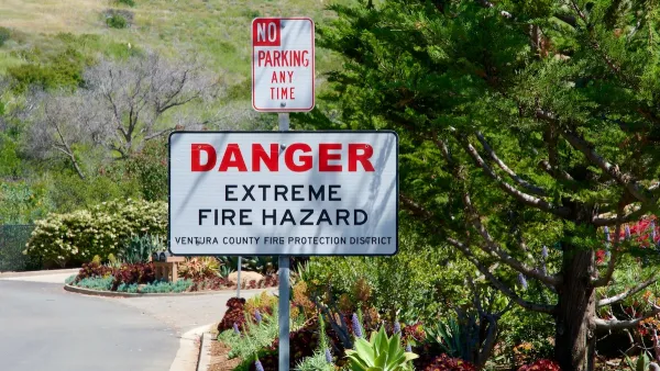 "Danger Extreme Fire Hazard" sign on street sign post below "No Parking" sign.
