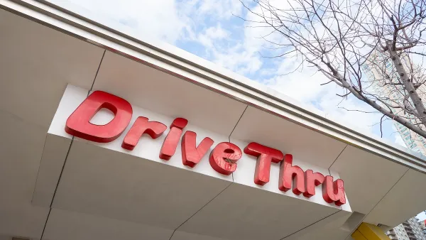 Close-up of red DriveThru sign at McDonald's fast food restaurant in Chicago, Illinois.