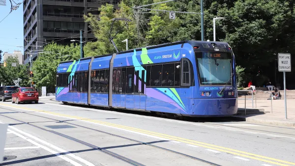 Blue Atlanta streetcar on street on sunny day in Atlanta, Georgia.