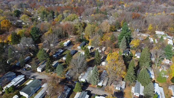 Aerial view of mobile home park with mature trees in Rochester, New York.