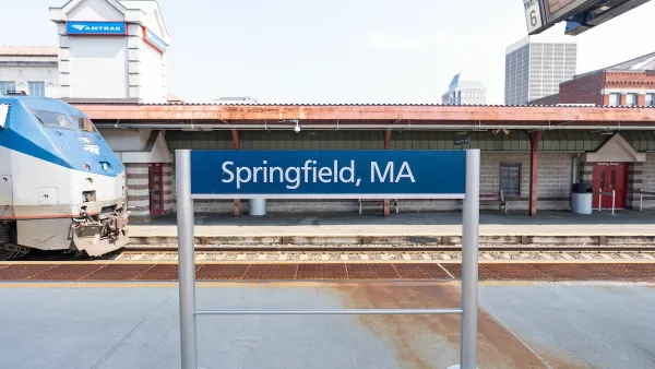 Springfield, MA outdoor Amtrak station platform with train pulling in.