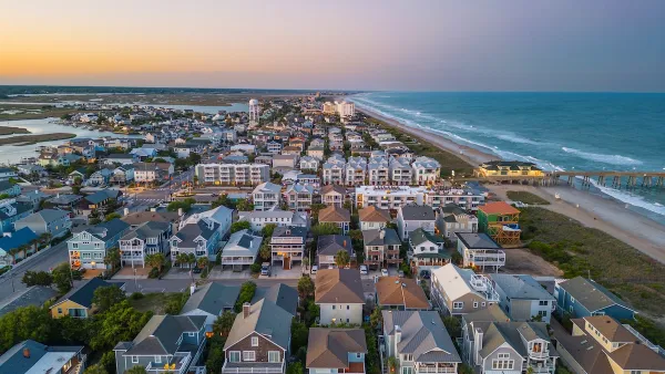 Aerial view of dense neighborhood with beach homes on coast in Wrightsville Beach, North Carolina.