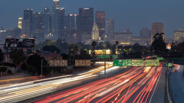 Early morning view of downtown Los Angeles with blurred heavy traffic on Interstate 10 in foreground.