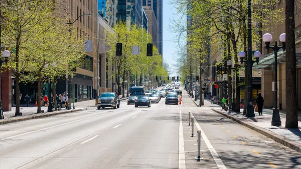 Street view of 4th Avenue, a commercial street of shops and restaurants through the city center of downtown Seattle, Washington.