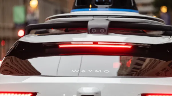 Close-up of back windshield of Waymo autonomous car.