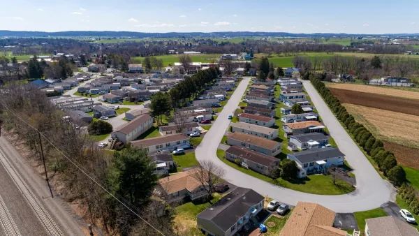 Aerial view of manufactured housing mobile home park in rural area.