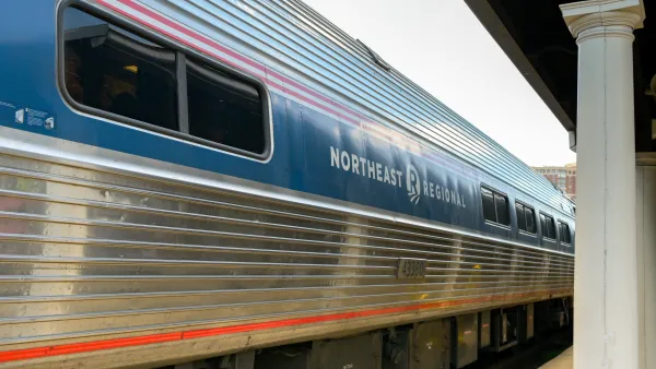 Amtrak train with Northeast Regional painted on the side sitting at a platform