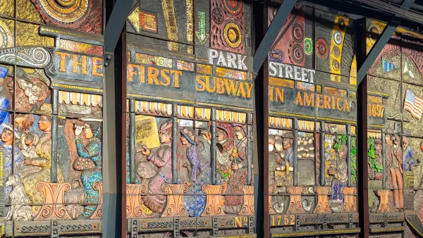 Relief panel in Boston subway station depicting "America's first subway."