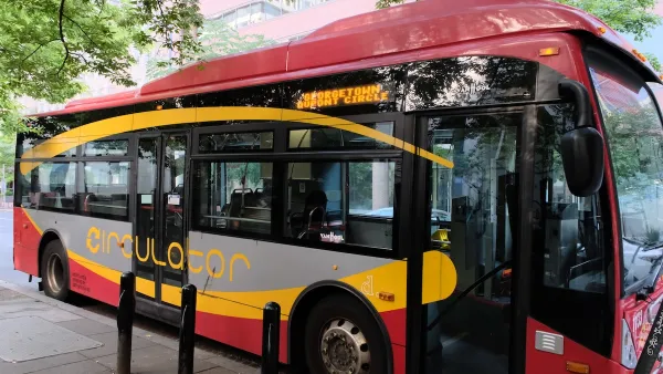 Red Washington, D.C. Metrobus Circulator bus parked at stop near Dupont Circle, Washington, D.C.