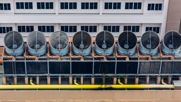 Aerial view of cooling towers on data center roof.