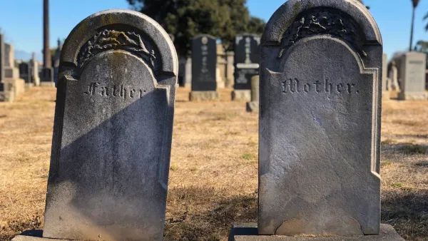 Cement gravestones reading Father and Mother
