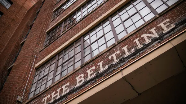 A sign reading Atlanta Beltline appears above the large doorway of a brick building.