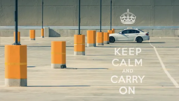A single car in an empty parking lot full of only bright yellow bollards. A caption on the image reads, "Keep calm and carry on."