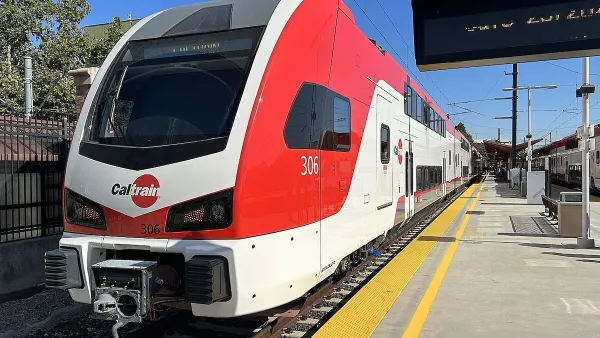 Red and white Caltrain electric train at platform in San Jose, California.