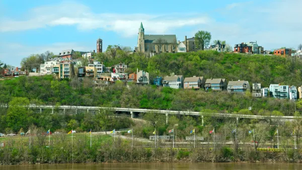Holy Cross Immaculata Church sits atop Mt Adams in Cincinnati, as seen from across the Ohio River in Kentucky.