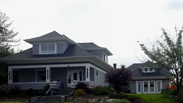 Craftsman-style two-story home with detached converted garage apartment accessory dwelling unit.