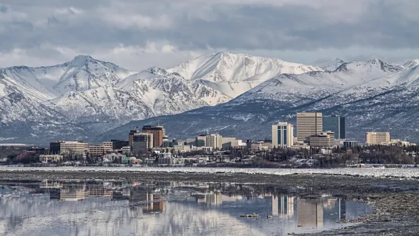 Downtown Anchorage with the snow covered Chugach Mountains in the background.