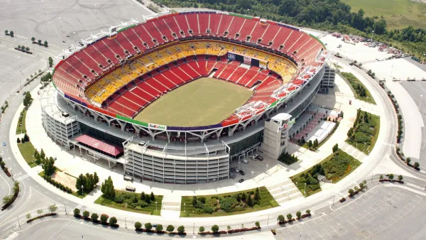 A aerial view of an empty FedEx Field, home of the NFL's Washington Commanders, and parking lot.