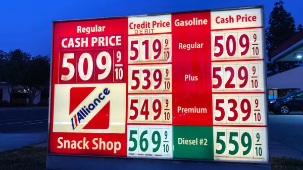 A sign showing gas prices, all at more than $5 a gallon.