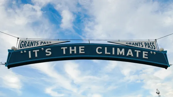 "It's The Climate" sign over street in Grants Pass, Oregon.