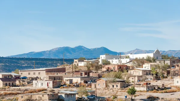 The Laguna Pueblo, a Native American reservation near Albuquerque, New Mexico, is perched on a hill in the sun.