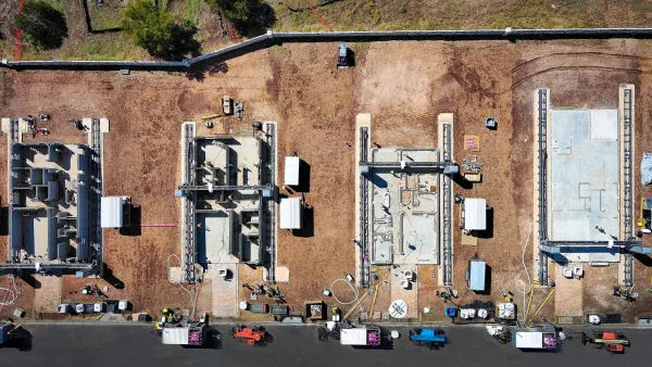 Overhead view of houses being 3d printed in concrete from the ground up.