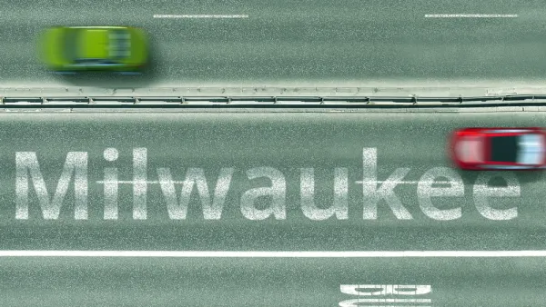 A blurred image shows two cars driving on a road labeled with the word Milwaukee.