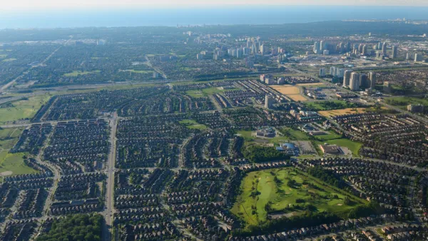 An aerial view of Mississauga, Ontario, with Lake Ontario in the background.