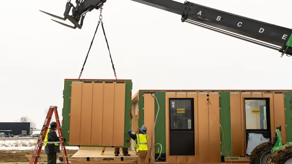 Modular housing being installed with crane.