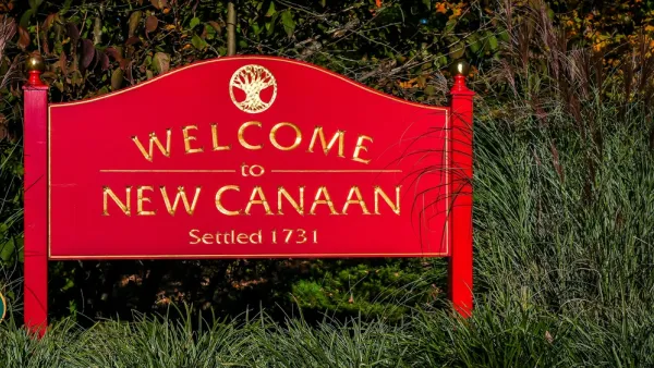 A red sign reads, “Welcome to New Canaan.”