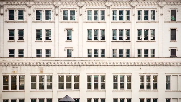 A closeup of rows of buildings lined by old fashioned windows in New York City.